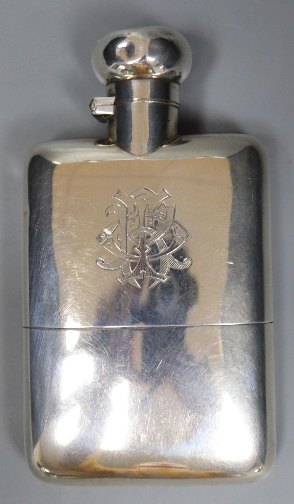 A late Victorian silver hip flask, Deakin & Francis, Birmingham, 1900, 12.9cm, gross 189 grams, with engraved monogram.